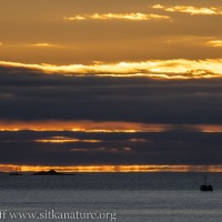 Fishing Boat and Kulichkof Rock at Sunset